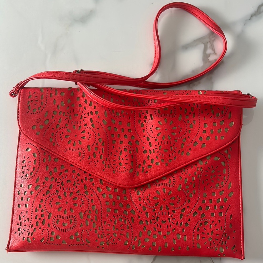 Kate & Mel laser cut design orangey-red clutch and crossbody strap bag